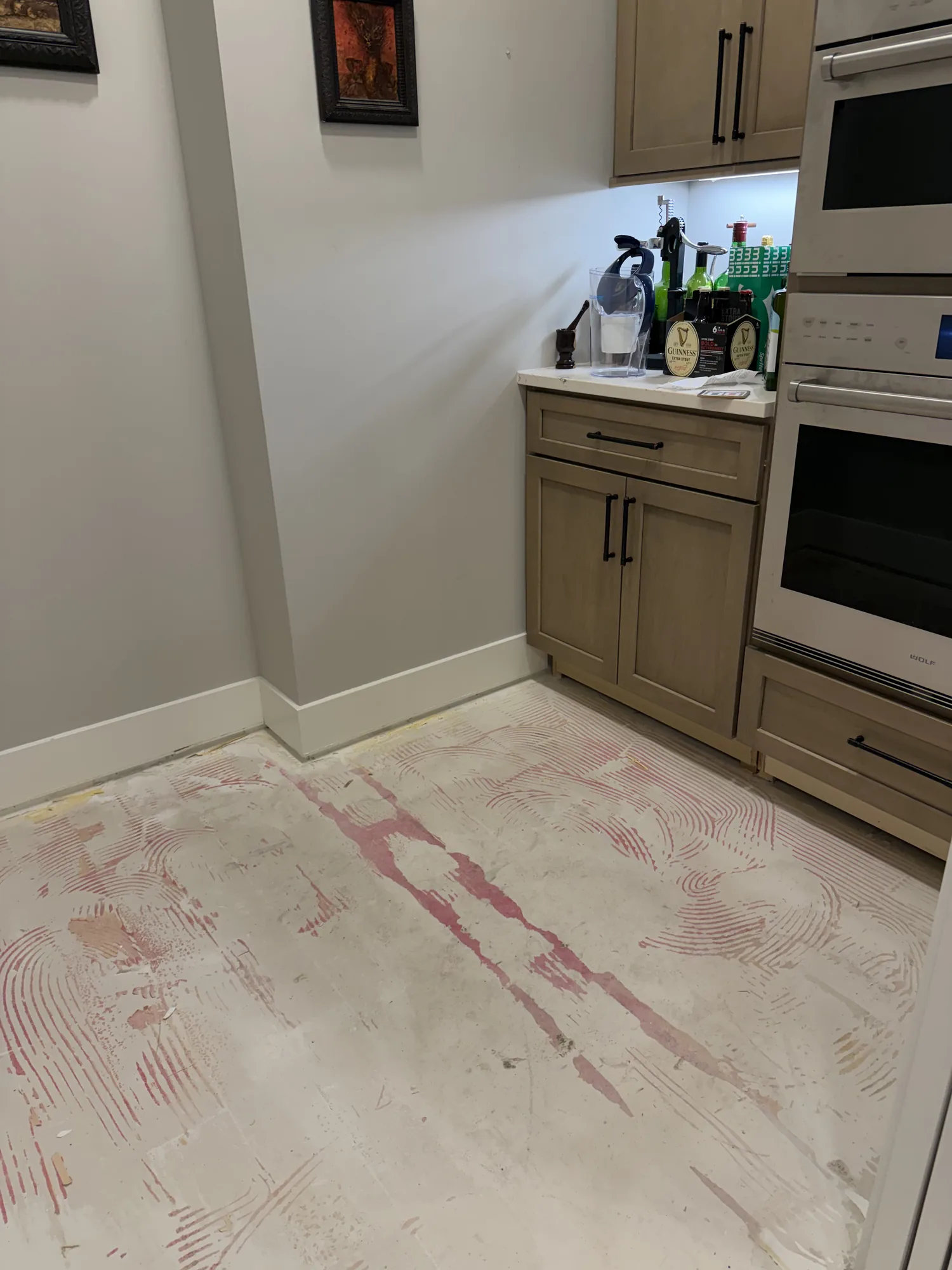 Wide-plank engineered oak flooring glued down over a concrete slab in a Twin Cities home
